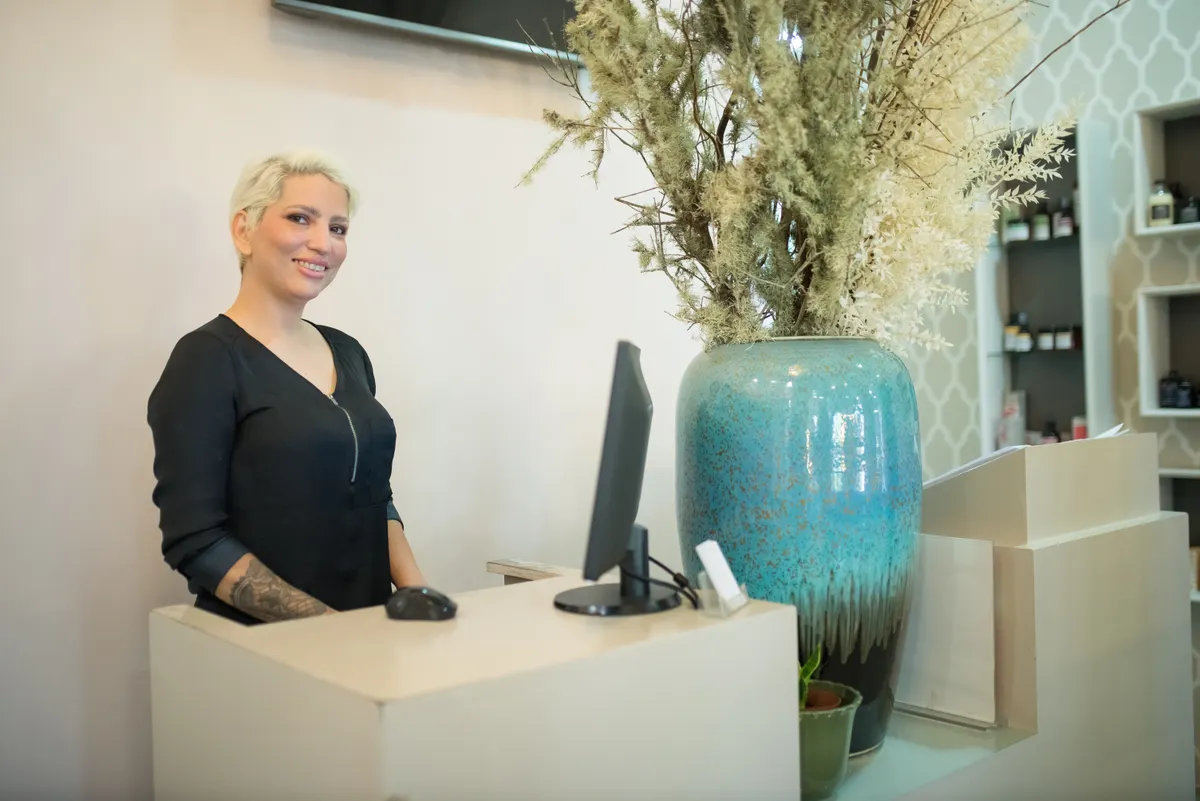 Med spa staff welcoming clients at the reception desk